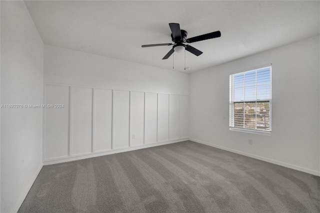 carpeted empty room with ceiling fan