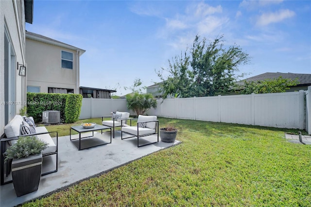 view of yard with central AC, an outdoor hangout area, and a patio area