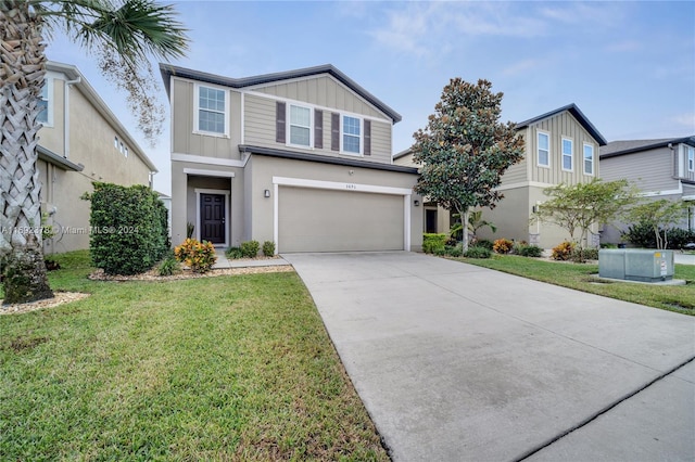 view of front of house with a front lawn and a garage