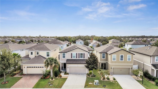 view of front of home with a garage and a front lawn