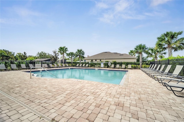 view of swimming pool with a patio area