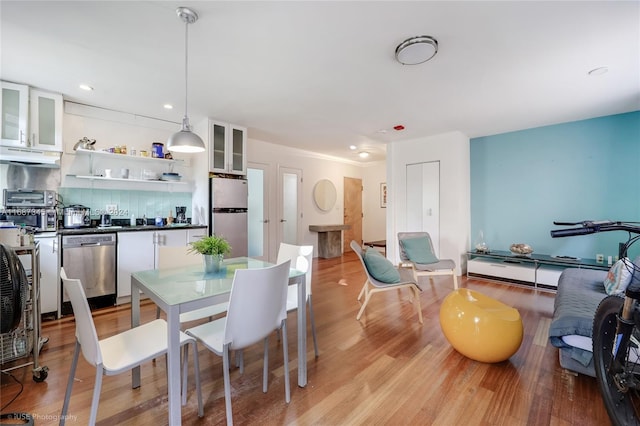 dining area featuring light wood-type flooring