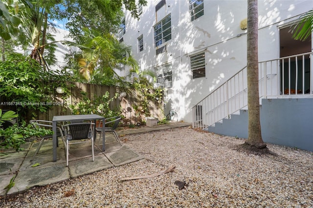 420 15th St Unit 107, Miami Beach, FL 33139 - view of patio / terrace featuring fence, stairs, and outdoor dining area