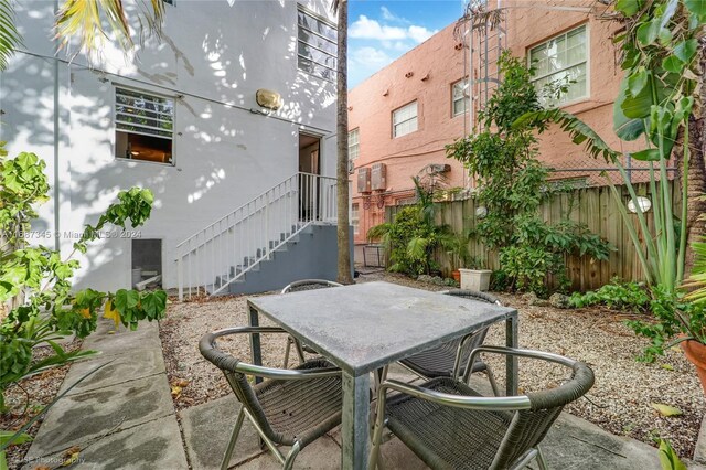 420 15th St Unit 107, Miami Beach, FL 33139 - view of patio / terrace with outdoor dining space and fence