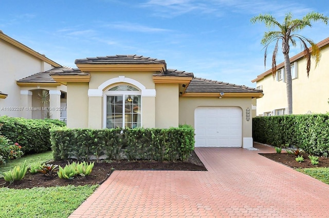 view of front of property with a garage