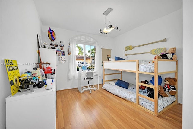 bedroom with hardwood / wood-style flooring