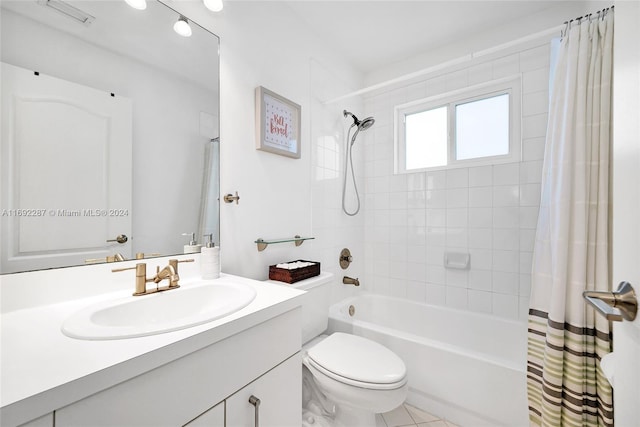 full bathroom with tile patterned flooring, vanity, toilet, and shower / bath combo with shower curtain