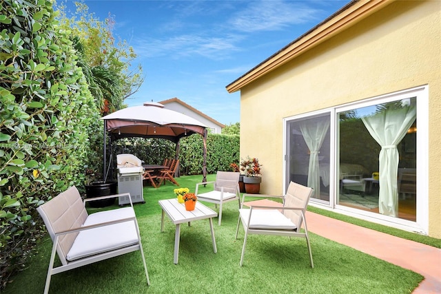 view of patio / terrace featuring a gazebo and grilling area