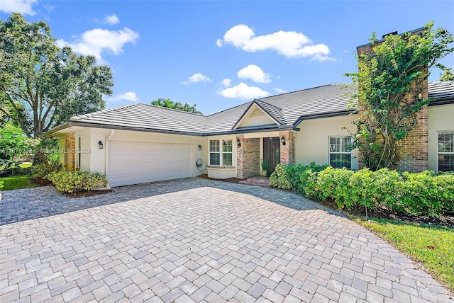 single story home with a garage