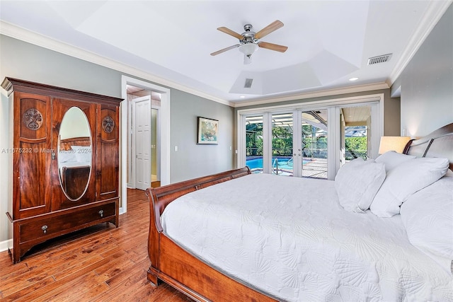 bedroom featuring french doors, crown molding, ceiling fan, access to exterior, and wood-type flooring