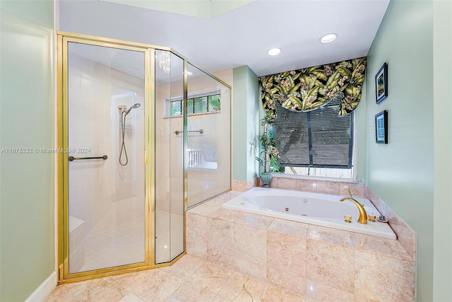 bathroom with separate shower and tub