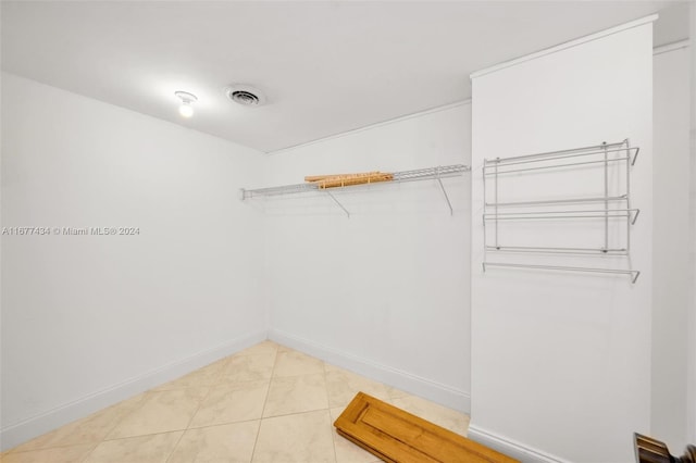 walk in closet featuring tile patterned flooring