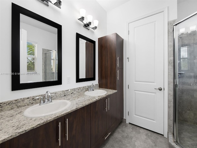 bathroom featuring tile patterned floors, vanity, and an enclosed shower