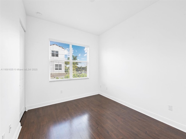 empty room featuring dark hardwood / wood-style floors