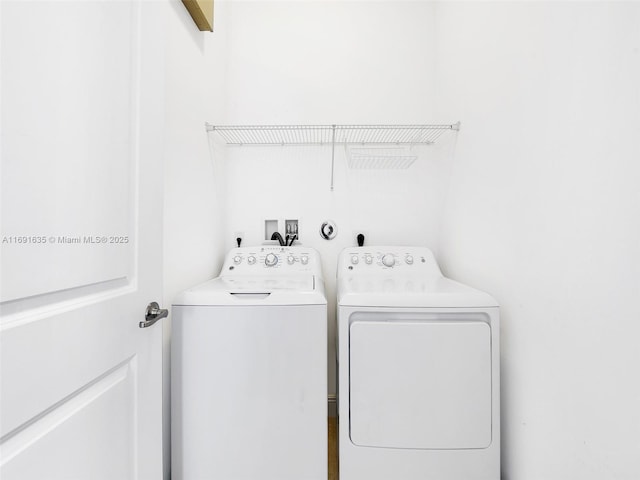 washroom with independent washer and dryer