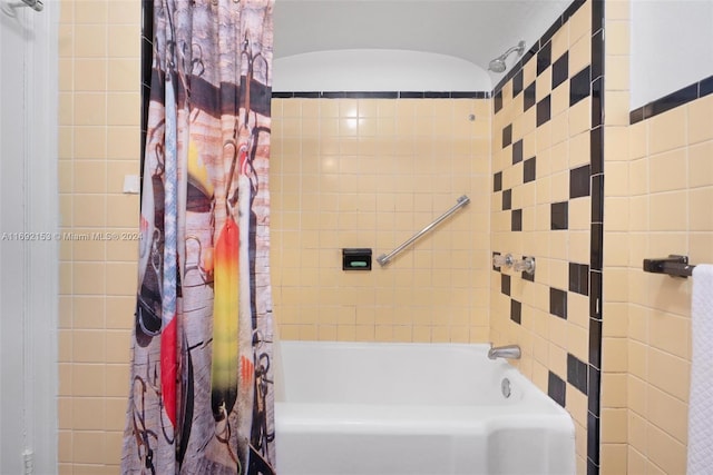 bathroom with shower / bath combination with curtain