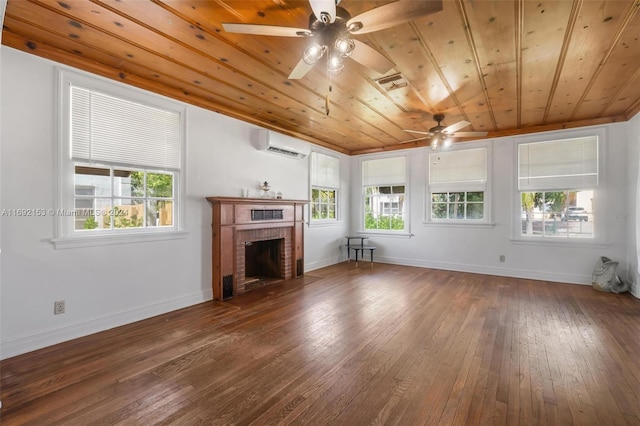 unfurnished living room featuring a fireplace, a wall unit AC, dark wood-type flooring, and wood ceiling