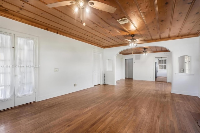 unfurnished living room featuring wood ceiling, wood-type flooring, ceiling fan, and crown molding