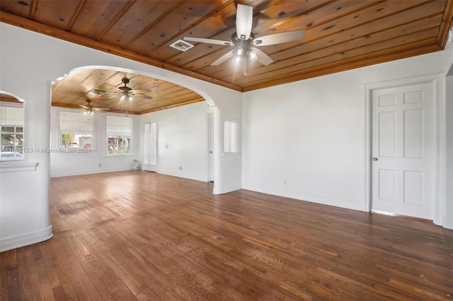 unfurnished living room featuring a wealth of natural light, wood-type flooring, crown molding, and wood ceiling