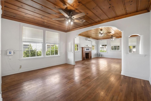 unfurnished living room featuring hardwood / wood-style floors, ceiling fan, wood ceiling, and an AC wall unit