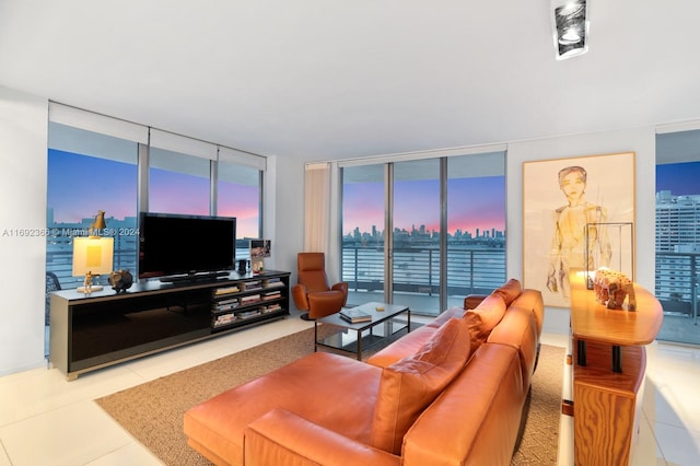 living room with light tile patterned floors and floor to ceiling windows