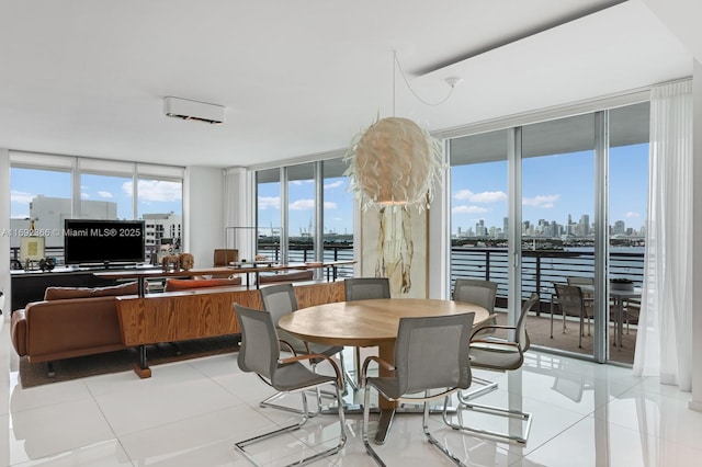 dining area featuring light tile patterned flooring and a city view