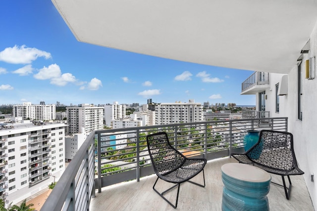 balcony featuring a view of city