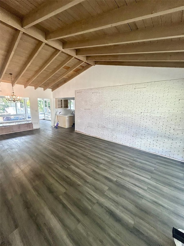 unfurnished living room featuring wood ceiling, dark wood-style flooring, vaulted ceiling with beams, and a notable chandelier