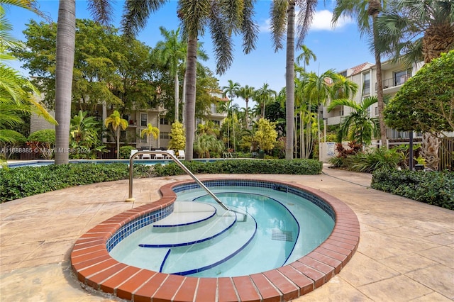 view of pool featuring a hot tub