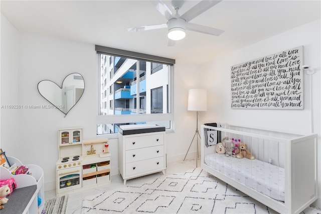 sitting room featuring ceiling fan