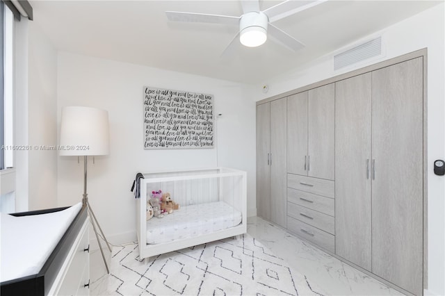 sitting room featuring ceiling fan