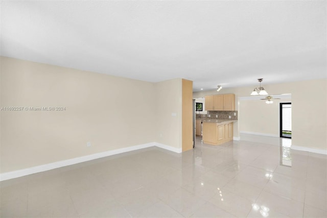 unfurnished living room with light tile patterned floors