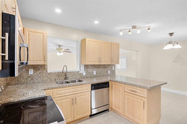 kitchen with stainless steel dishwasher, sink, kitchen peninsula, and light brown cabinets