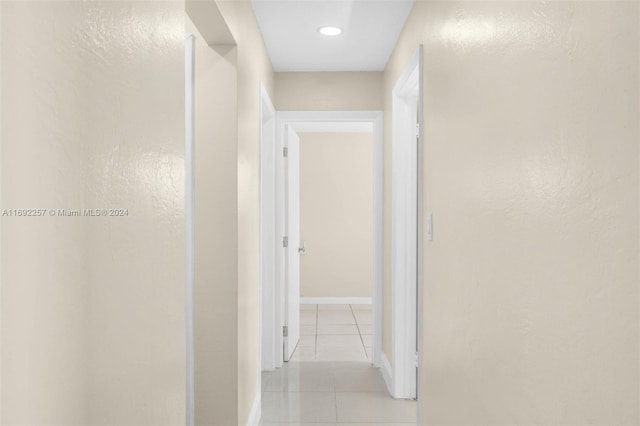 hallway with light tile patterned floors