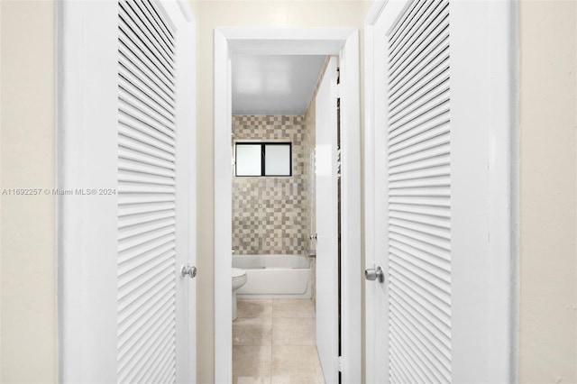 corridor with light tile patterned flooring