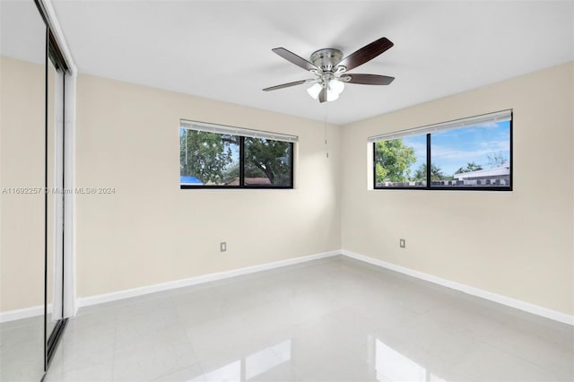 empty room featuring ceiling fan