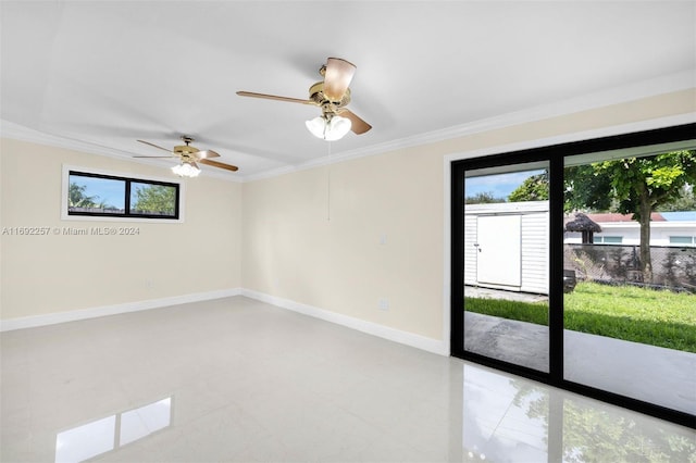 unfurnished room featuring ceiling fan, tile patterned floors, and ornamental molding