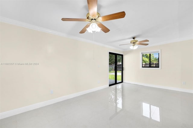 tiled spare room with ceiling fan and ornamental molding