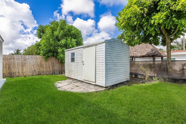 view of outbuilding featuring a yard