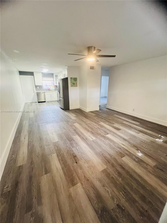 unfurnished living room with light wood-type flooring and ceiling fan