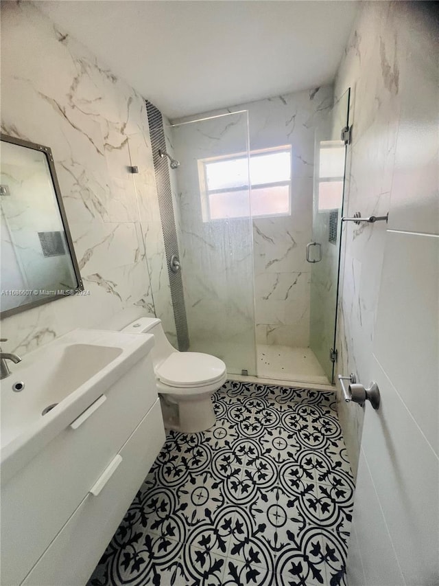 bathroom featuring walk in shower, vanity, and toilet