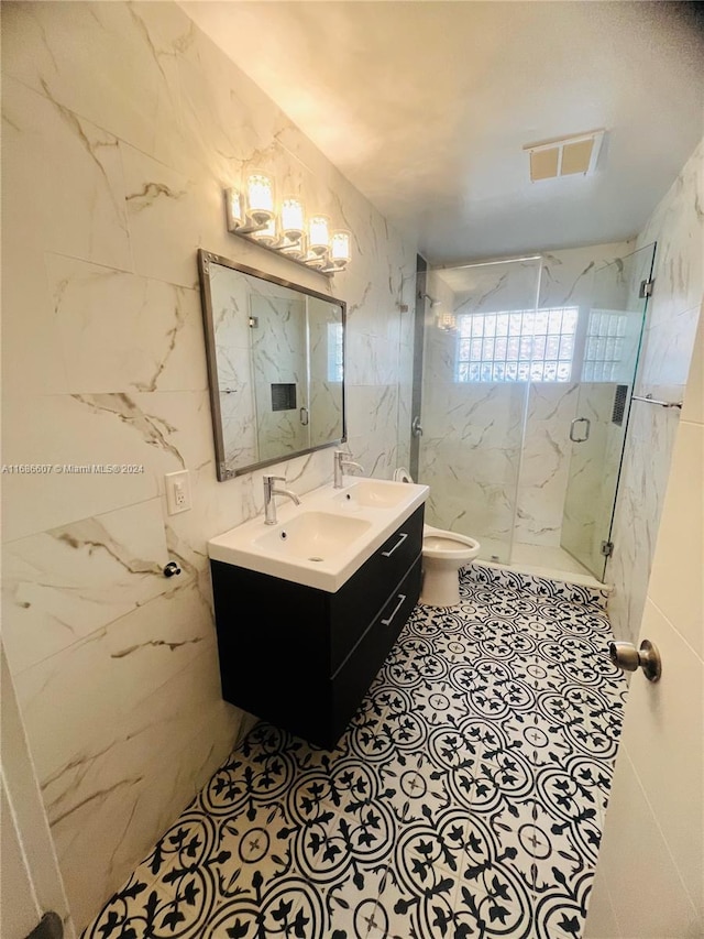 bathroom with walk in shower, tile walls, vanity, and toilet