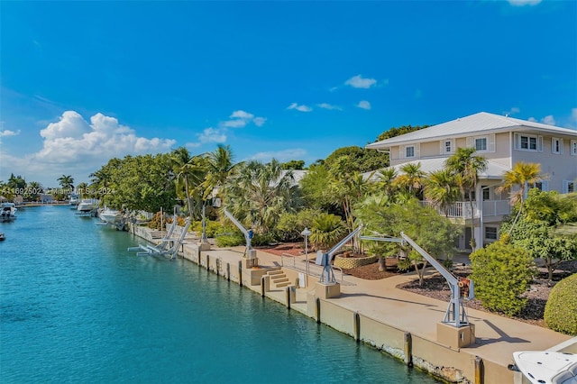 exterior space featuring a water view and a dock