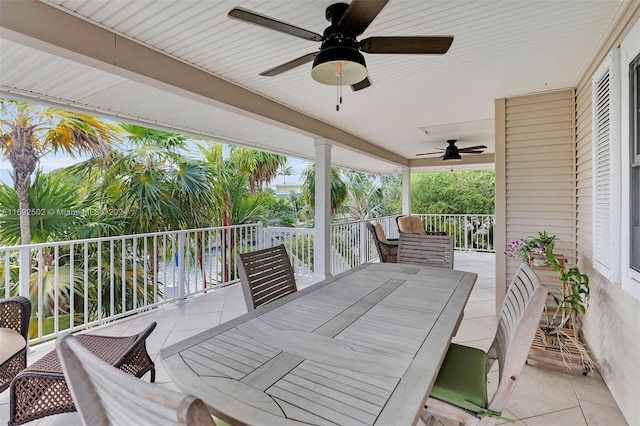 view of patio / terrace with a water view and ceiling fan