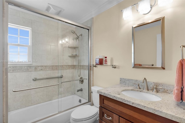 full bathroom featuring toilet, vanity, bath / shower combo with glass door, and crown molding