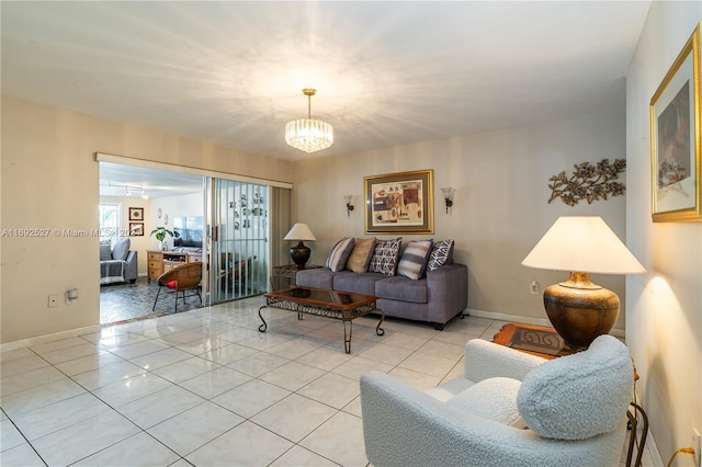 living room featuring light tile patterned floors and an inviting chandelier