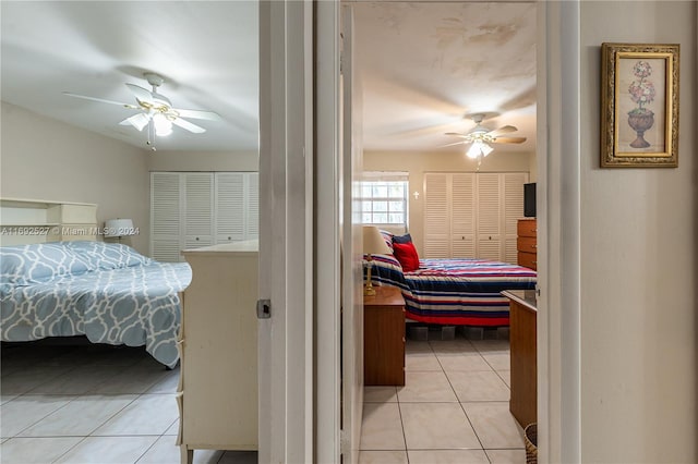 bedroom with light tile patterned floors and ceiling fan