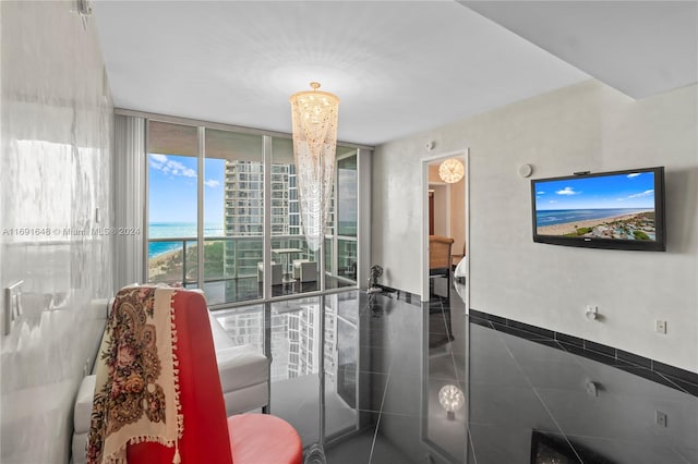 bathroom with floor to ceiling windows and a chandelier