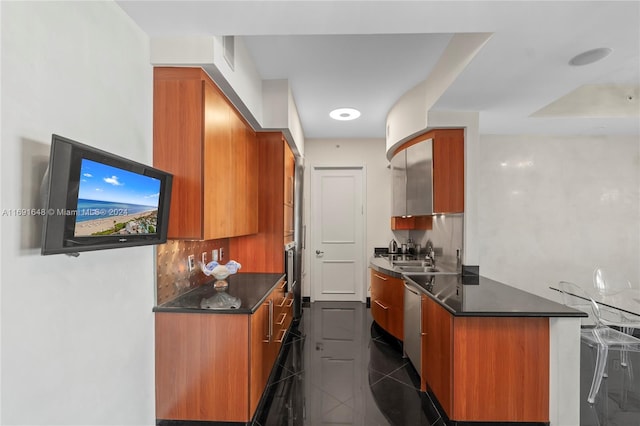 18101 Collins Ave Unit 1502, Sunny Isles Beach, FL 33160 - kitchen featuring brown cabinetry, dark countertops, modern cabinets, and granite floors