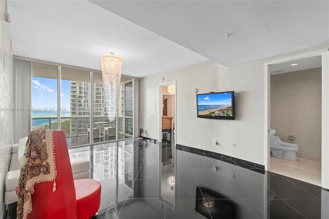 18101 Collins Ave Unit 1502, Sunny Isles Beach, FL 33160 - living room featuring tile patterned floors, a water view, and baseboards